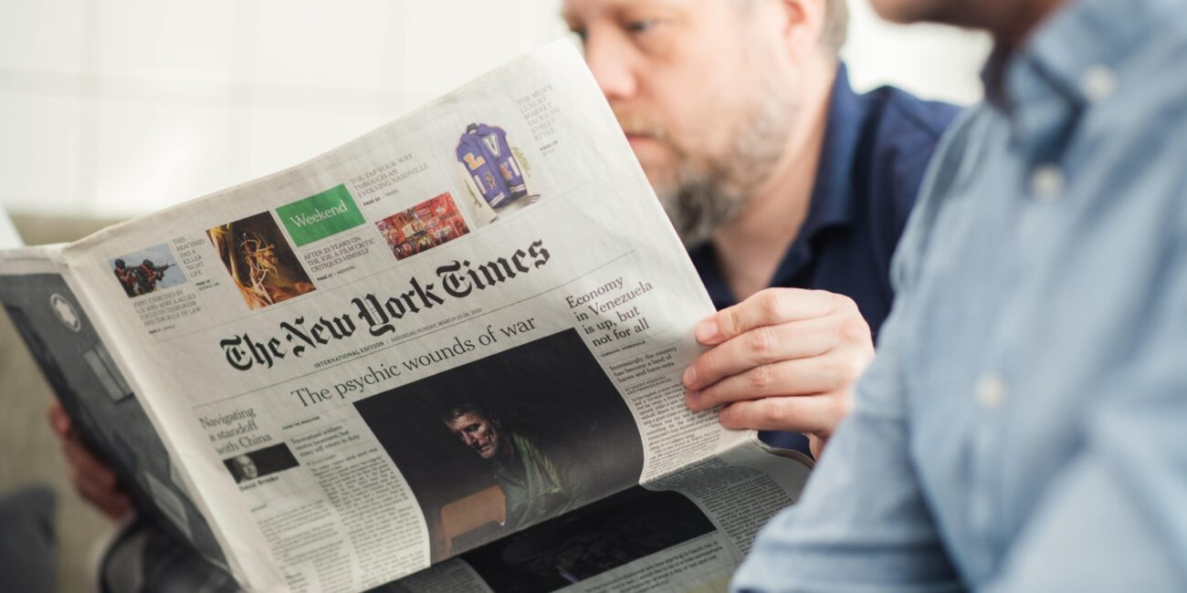 Man reading the New York Times newspaper