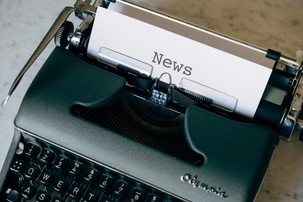 Page in a typewriter that reads 'News'